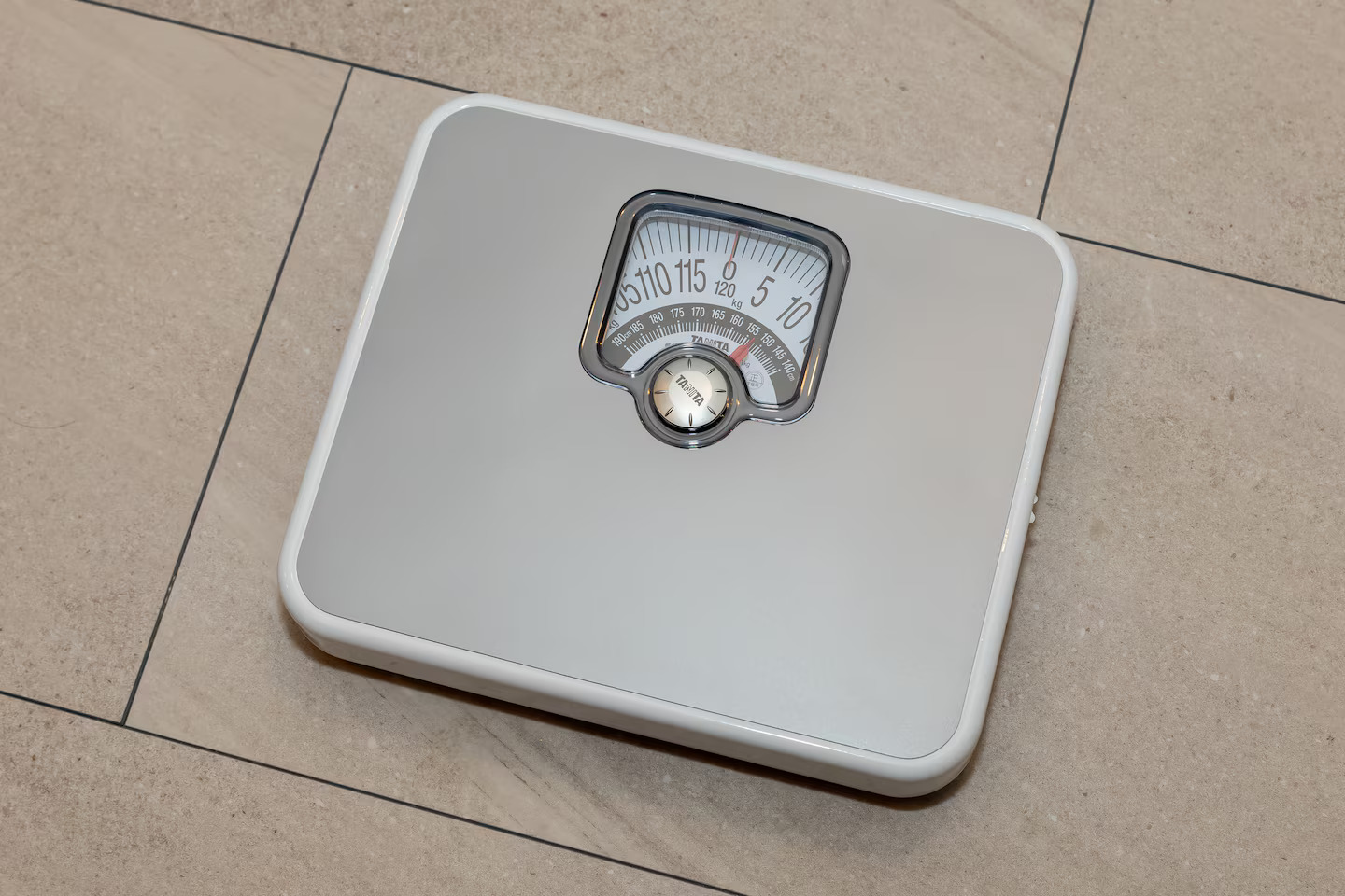 Luggage scale inside cupboard drawer