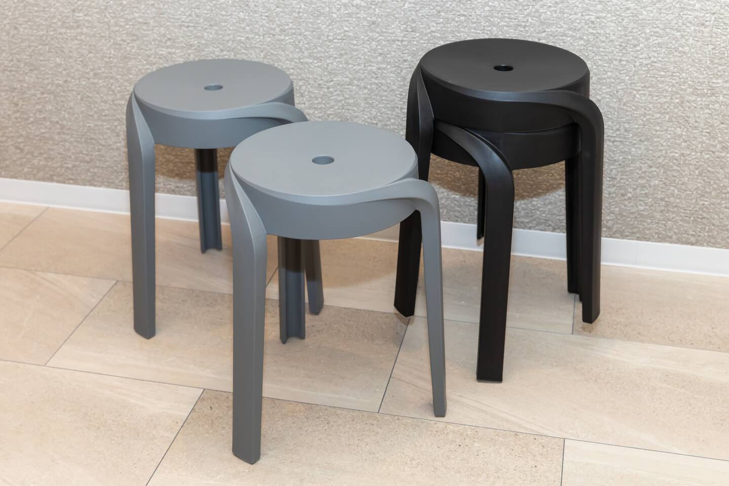 Stacked matte grey stools